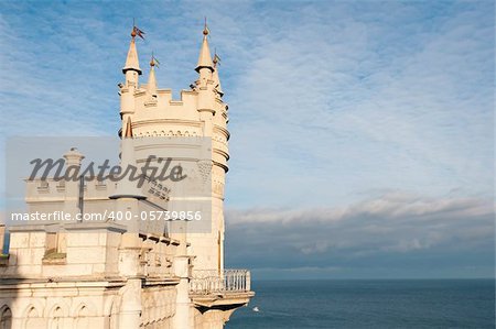 Swallow's Nest Castle tower, Crimea, Ukraine, with blue sky and sea on background