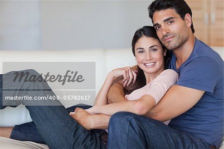 Lovely young couple posing in their living room