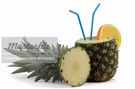 Pina Colada in Pineapple with orange and straws, isolated on white