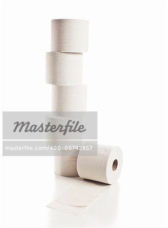 Rolls of toilet paper arranged on white background