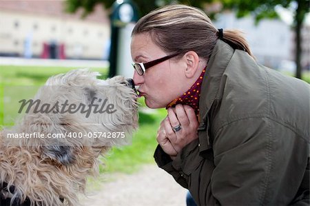 Woman and her dog with love in the park