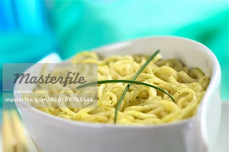 Vegetarian Asian noodle soup garnished with chives (Selective Focus, Focus on the intersection of the two chives)