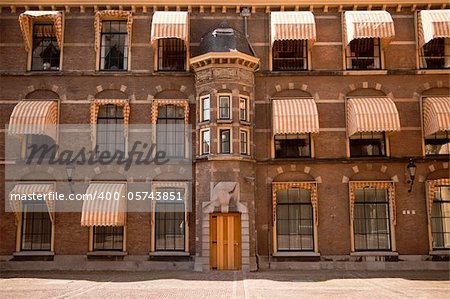 Striped canopies provide shade for the offices inside the inner courtyard of the Binnenhof complex in The Hague is now the seat of the Dutch Parliament.