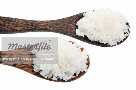 Wooden Spoons with Rice on White Background