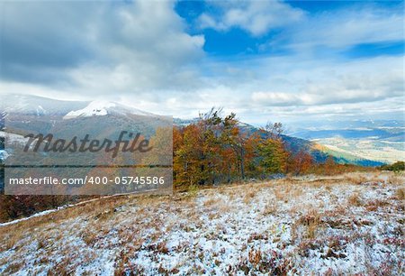 October Carpathian mountain plateau with first winter snow and autumn colourful foliage
