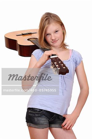 Portrait of a teenage girl holding a classical guitar
