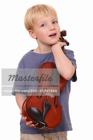 Portrait of a young boy holding his violin