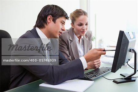 Focused business team working with a computer in an office