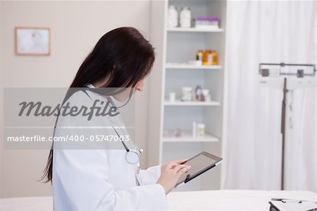 Doctor using a tablet computer in a hospital