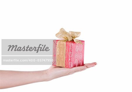Hand with red gift isolated over white background