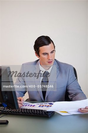 Young businessman doing paperwork