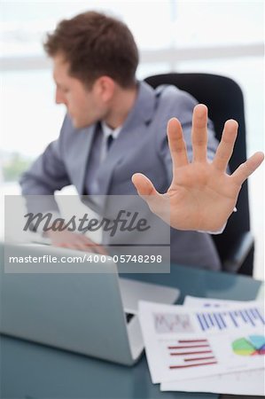 Hand of businessman being used to signal rejection