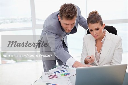 Business team working on poll results together