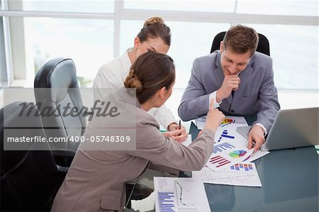 Business team discussing over market research results