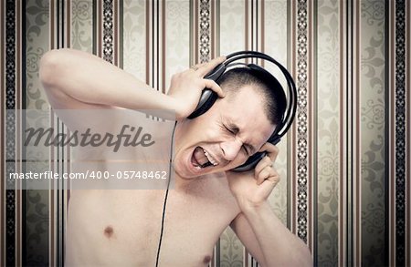 Young man enjoying music on headphones