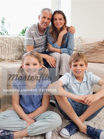 Portrait of a happy family posing in a living room