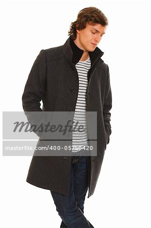 Portrait of thoughtful young man in winter coat