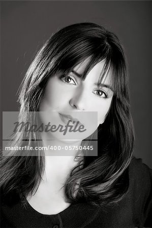 Black and White portrait of a beautiful young woman with a lovely espression