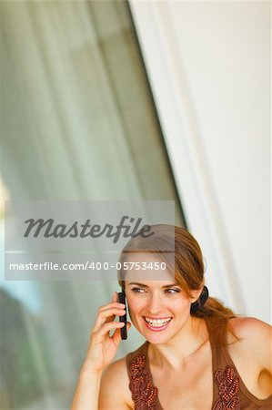 Portrait of beautiful woman speaking mobile phone