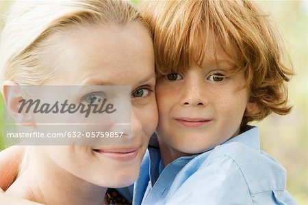 Mother and young son embracing, portrait