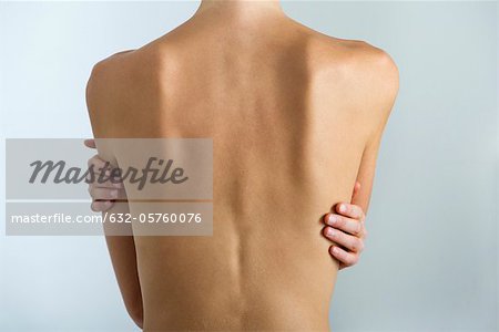 Woman's naked back, mid section