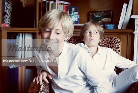 Brothers sitting in armchir, portrait