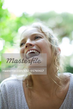 Young woman laughing, portrait