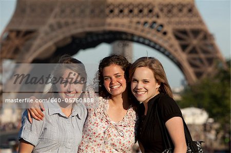 France, Paris, Portrait of three young women in front of Eiffel Tower