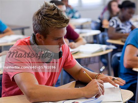 USA, Utah, Spanish Fork, School boy (16-17) working in classroom