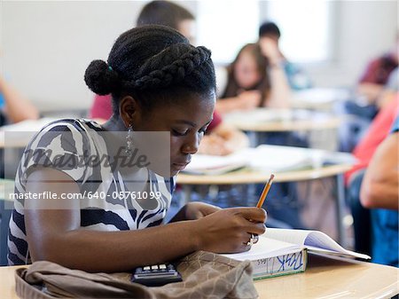 USA, Utah, Spanish Fork, School girl (14-15) working in classroom