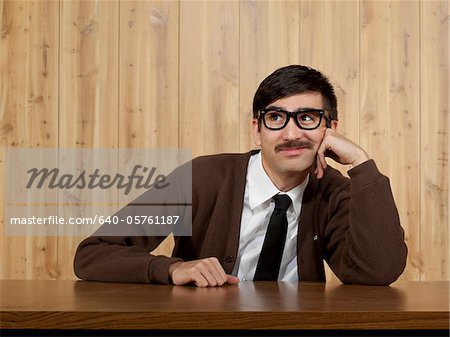 Bored businessman at desk in office