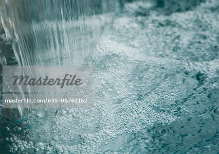 Waterfall in pool, close-up Waterfall in pool, close-up