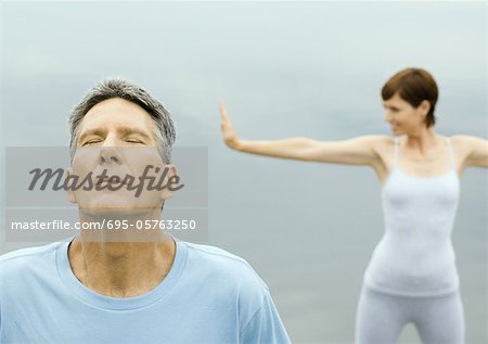 Mature couple exercising