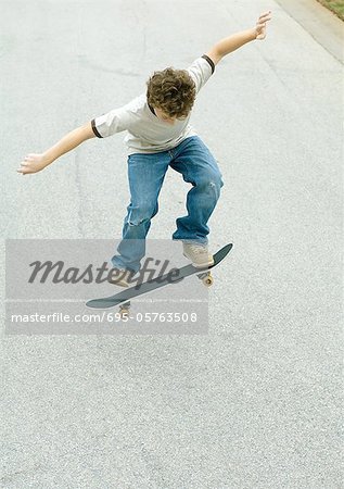 Boy jumping with skateboard