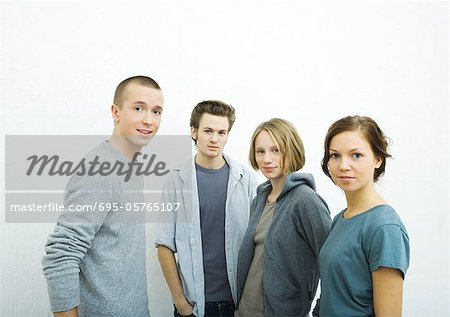 Four young friends, looking at camera, portrait