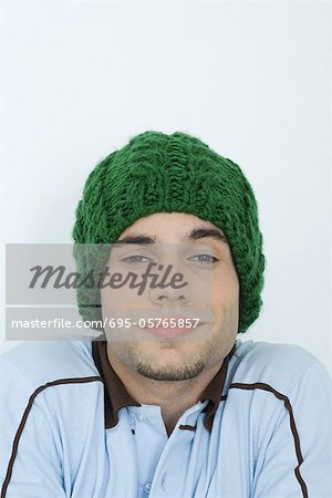 Young man wearing knit hat, portrait, close-up