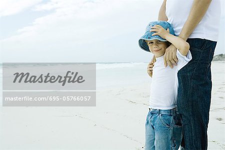 Child and parent on beach