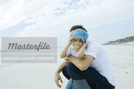 Father and child on beach