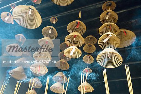 Incense hanging from ceiling in Chinese temple, low angle view