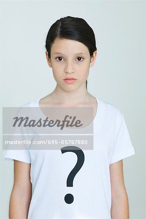 Girl wearing tee-shirt printed with question mark, looking at camera