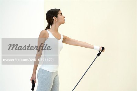 Woman exercising with resistance band