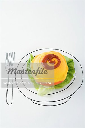 Plastic hamburger with lettuce and ketchup on drawing of plate