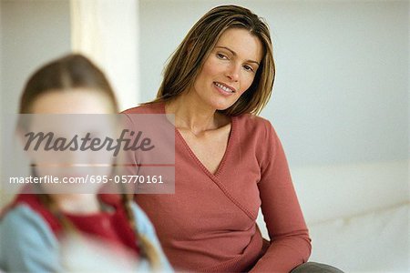Mother looking at daughter with pride