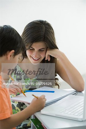 Tutor helping elementary school student