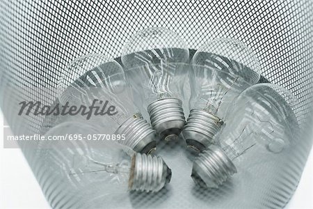 Conventional light bulbs in garbage can