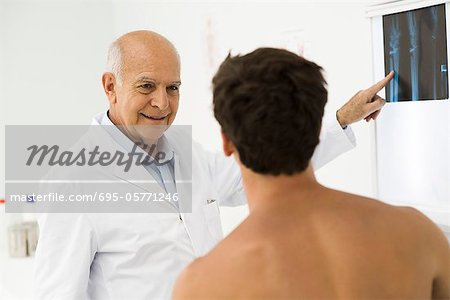 Doctor explaining x-ray to patient