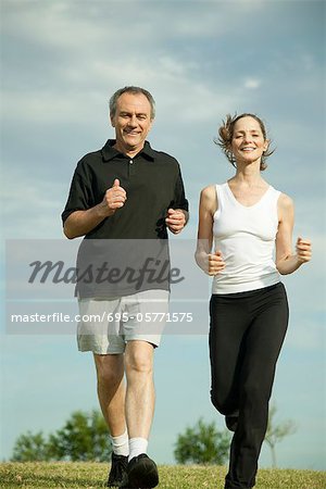 Mature couple jogging together