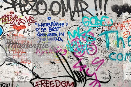 Graffiti covering a section of the Berlin Wall, Berlin, Germany Graffiti covering a section of the Berlin Wall, Berlin, Germany