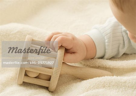 Baby with rattle