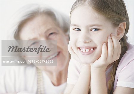 Girl and grandmother, smiling